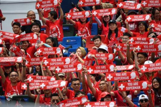 fans_of_roger_federer_of_switzerland_hold_up_signs_as_he_takes_part_in_an_exhibition_event_one_day_before_the_start_of_the_shanghai_masters_tennis_tournament_in_shanghai_on
